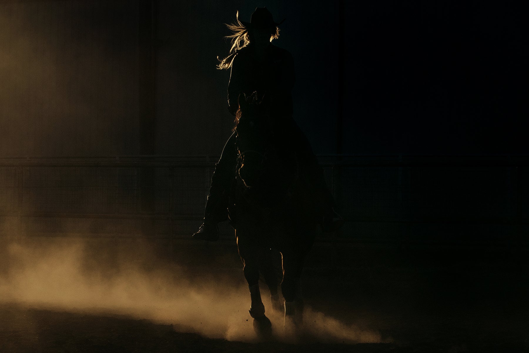Art print silhouette of a woman riding a horse in a ring in Alpine, Texas.